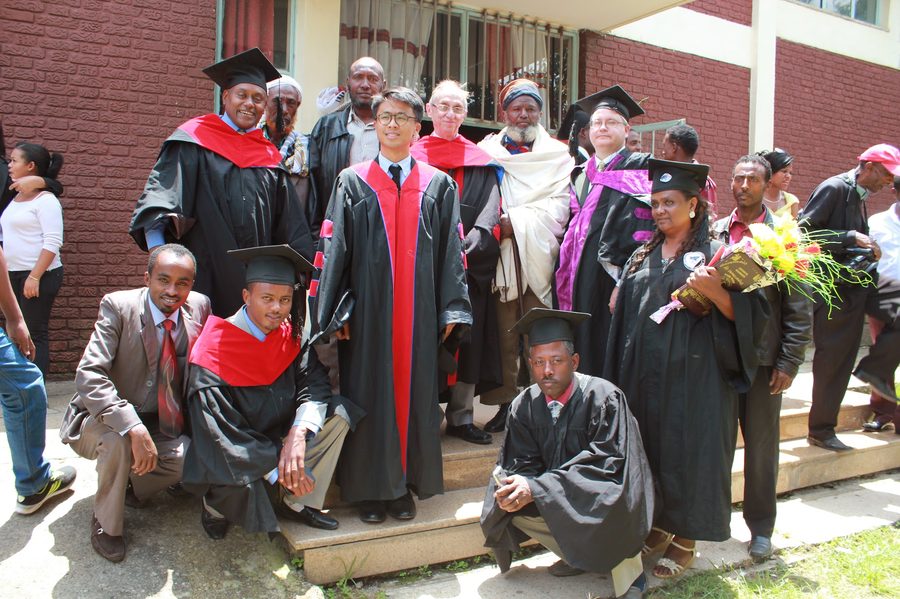 Thomas Norman in regalia with graduates in Ethiopia